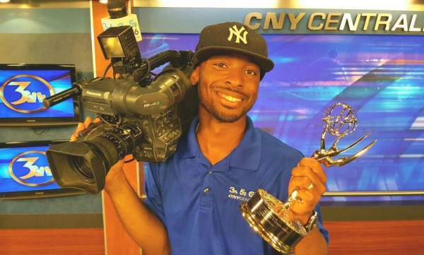 quindell with his camera and his emmy